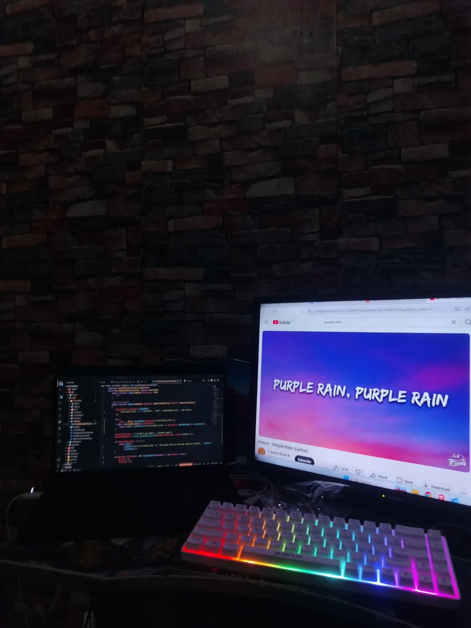 A dual-screen development workspace with source code open
